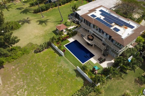 Beautiful home with pool and back yard leading to the ocean.