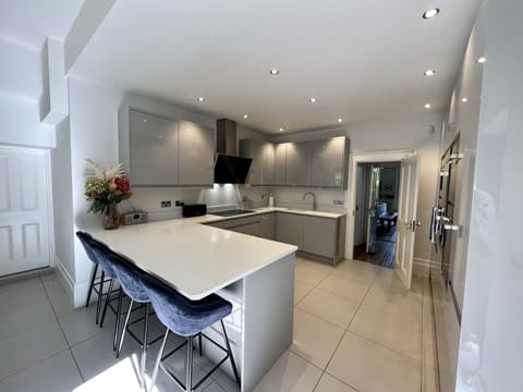 The kitchen has a large fridge freezer+ extra freezer in utility+ drinks fridge