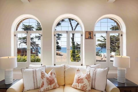 Ocean view from living room through arched windows.