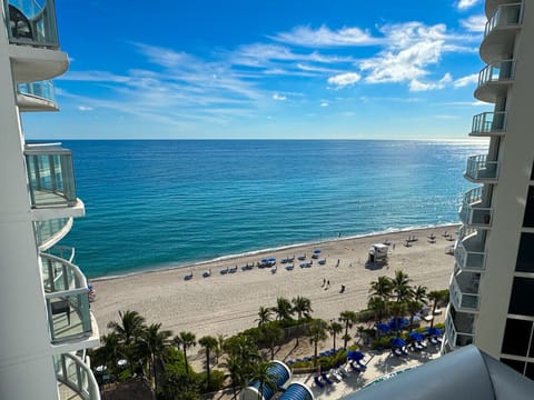 Private balcony with outdoor seating and skyline views.