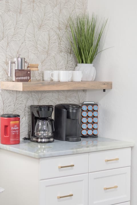 Fully stocked coffee bar with drip coffee, Keurig, french press and pour over coffee with all condiments!