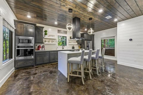 This beautifully designed kitchen is both functional and elegant, equipped with everything needed for the gourmet chef or casual cook to create culinary delights.