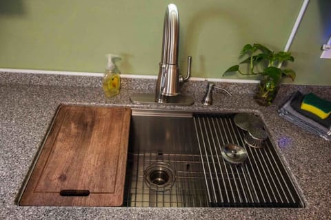 The sink was recently upgraded and features a deep basin and some fun over sink accessories
