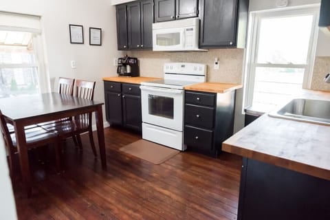 The kitchen includes full working oven, stove and microwave