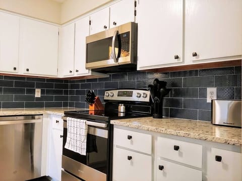 Enjoy cooking up a family meal in the fully stocked kitchen!  (kitchen of 4-bedroom home shown)