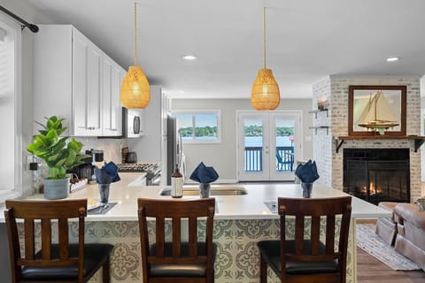 Sit at counter for meals and enjoy the amazing views of the lake through the French doors and keep the cook company while they prep the next meal.