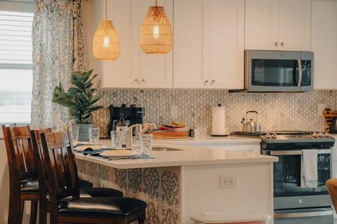 The kitchen is an easy space for meal prep.  The appliances include a gas range and oven, a microwave, and a side-by-side refrigerator with in-door water and ice service.  The Keurig coffee maker is dual function: make single cup or a whole pot.