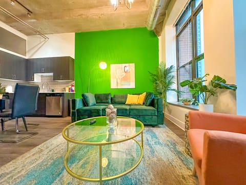 Spacious living room with a lot of natural light and large windows.