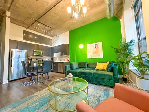 Spacious living room with a lot of natural light and large windows.