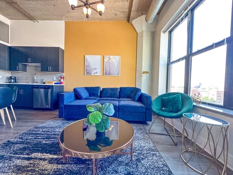 Spacious living room with a lot of natural light and large windows