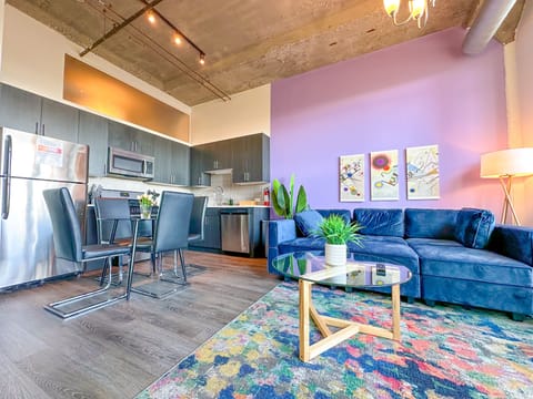 Spacious living room with a lot of natural light and large windows.