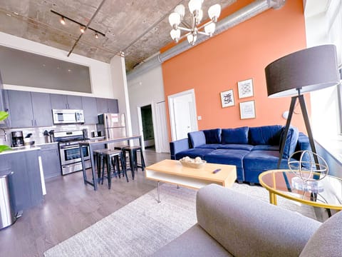 Spacious living room with a lot of natural light and large windows