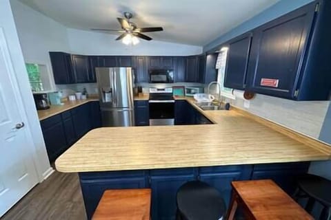 Large kitchen with lots of counter space and several appliances
