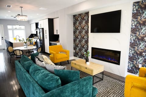 Living room with fireplace & large smart TV