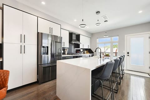 Open kitchen with modern appliances and a large island for cooking