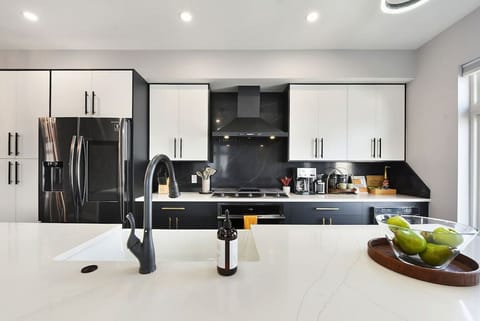 Open kitchen with modern appliances and a large island for cooking