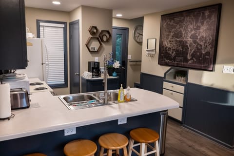 Full kitchen and stools for the bar