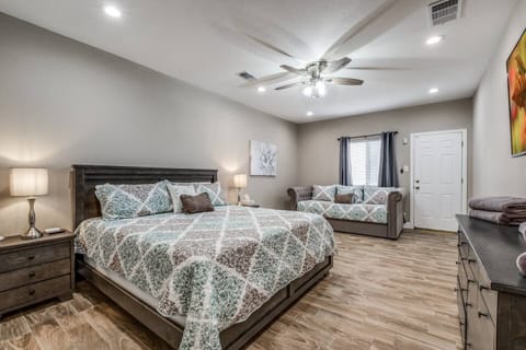 Texas sized Master Bedroom that features a king bed, day bed and twin trundle.