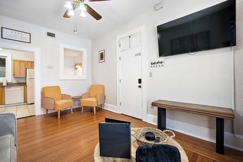 Cozy up in style on our adorable yellow accent chairs at Downtown Digs. Perfect for extra seating or binge-watching your favorite shows on the 55" smart TV. Comfort and entertainment await!