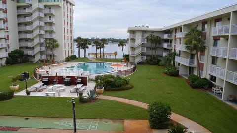 Beautiful pool with lots of outdoor space with grills to barbeque.