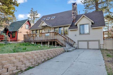 Welcoming cabin entry surrounded by towering pine trees, offering fresh mountain air and a peaceful forest setting—the perfect first impression for your Big Bear Lake getaway.