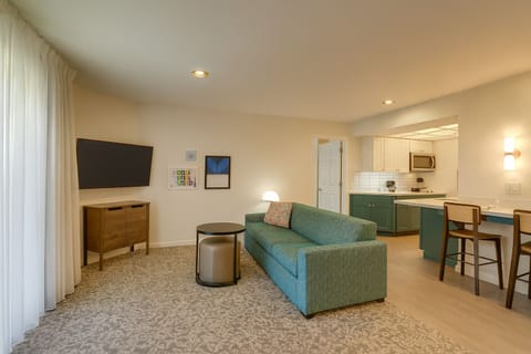 Gather together in an open-plan suite made for relaxing.