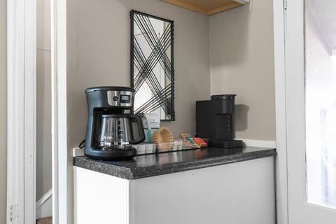 Coffee bar includes all the essentials for your morning brew including a 12-cup coffee maker, Keurig, and a starter pack of ground coffee, tea, K-cups, sweeteners, and creamer!