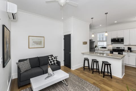 Charming, open floor plan includes living room, dining space, and kitchen