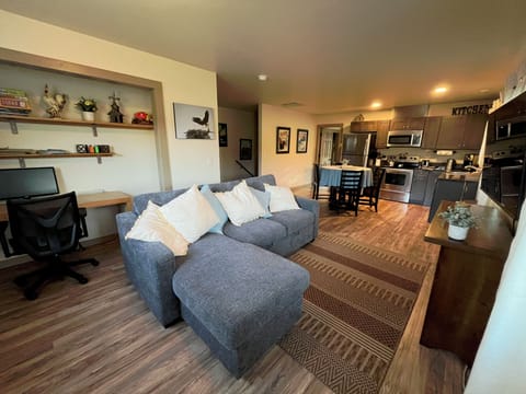 Comfortable sofa in open living space. Sofa pulls out to form a queen sized bed