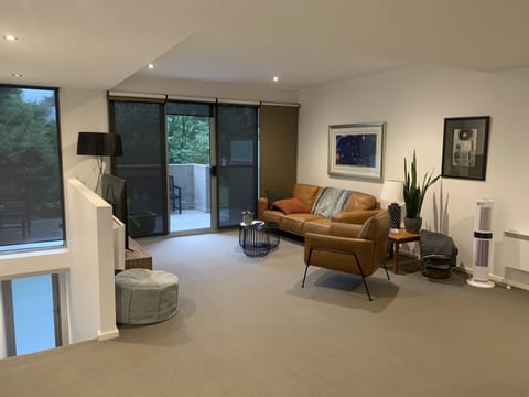 Living area has access to large outdoor balcony which overlooks parkland