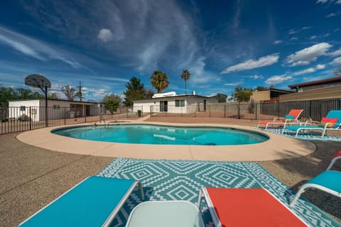 Large backyard with pool and hot tub, basketball court to the left (pool is unheated; hot tub heated w/ fee))