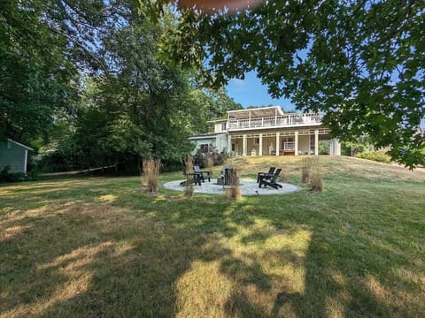 Large backyard and well-equipped fireplace perfect for family gatherings.
