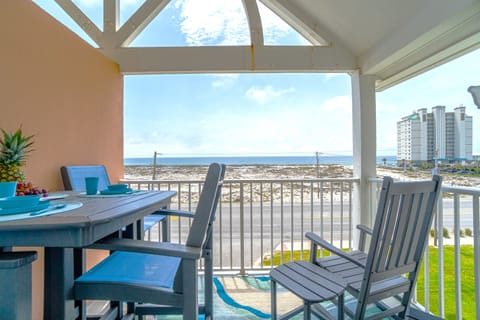 Peaceful mornings of dolphin watching await on the private balcony just across the street from the Gulf