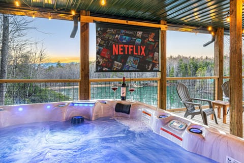 Relax and unwind in this luxurious hot tub with a breathtaking view — the perfect serene getaway to rejuvenate your senses.