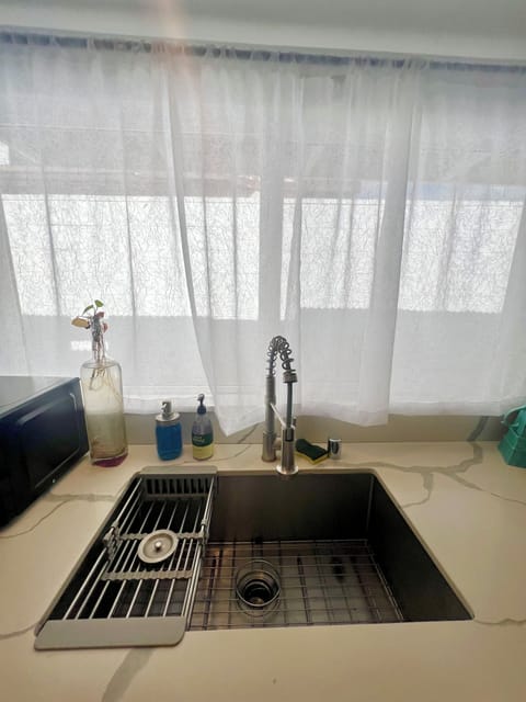 Large stainless steel sink with window