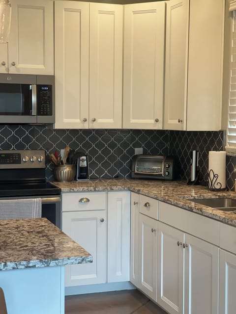 Plenty of counter space, full sized oven and microwave, and toaster oven.