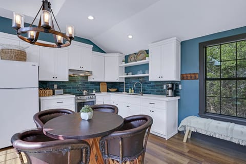 Dining table for four adjacent to kitchen