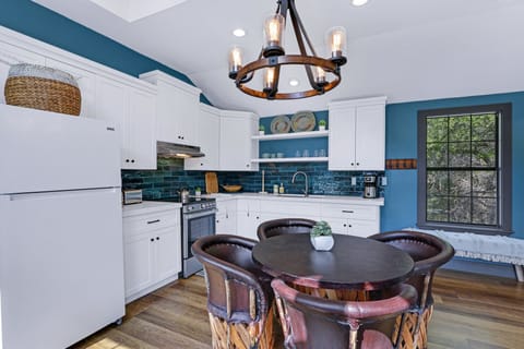 Kitchen with refrigerator and range/oven combo.