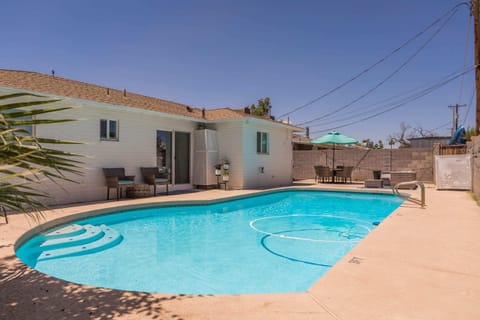 Private backyard with pool, bbq and patio seating