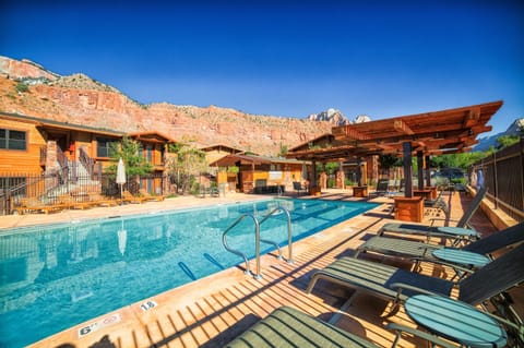 Dive into the sparkling pool framed by red-rock cliffs.
