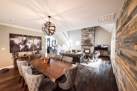 Living and Dining room with gas fireplace and smart TV with every package
