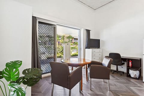 Relax and unwind in this comfortable living space, featuring plush seating and a view of the outdoors.