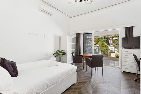 Unwind in this bed, featuring a comfortable bed and a cozy living area.