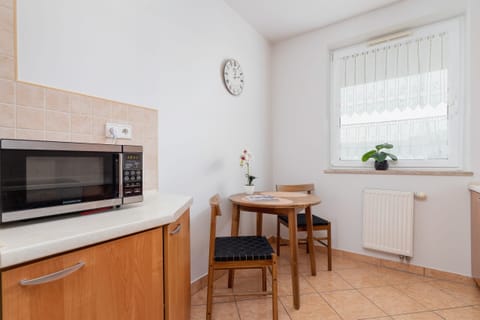 The kitchen is fully equipped with all necessary appliances and utensils. 