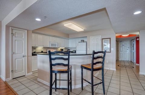 Dining area with chandelier and round table and sitting area