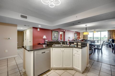 Kitchen with ample counter space and red accent wall