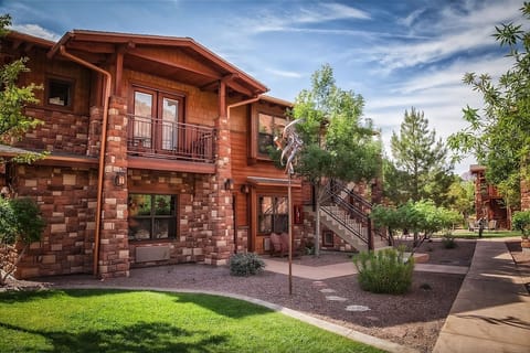 Step outside to stone-and-wood charm set in desert greens.