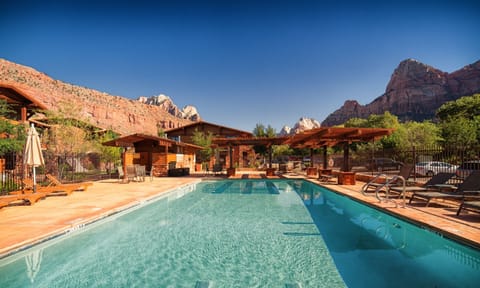 Soak up sunshine by the sparkling pool with mountain views.