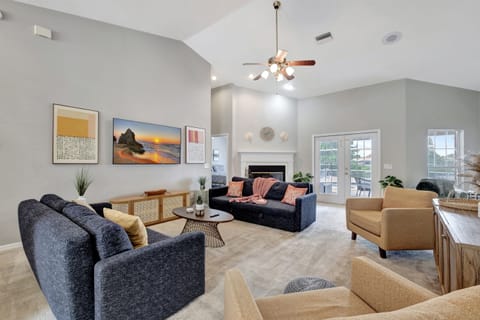 Two luxurious dark blue sofas take center stage, offering ample seating for relaxation and socializing.