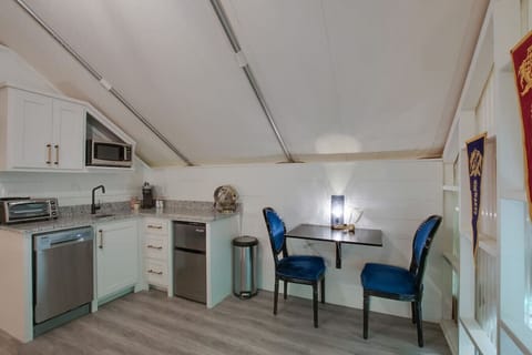 Glamping tent with a tasteful and fun décor, dining space for a meal in, perfect for fun-filled evenings and relaxation in nature.